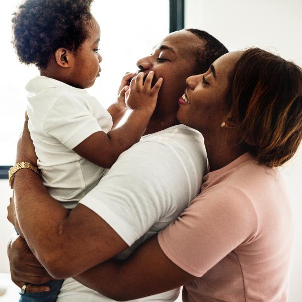 Son playing with mom and dad.