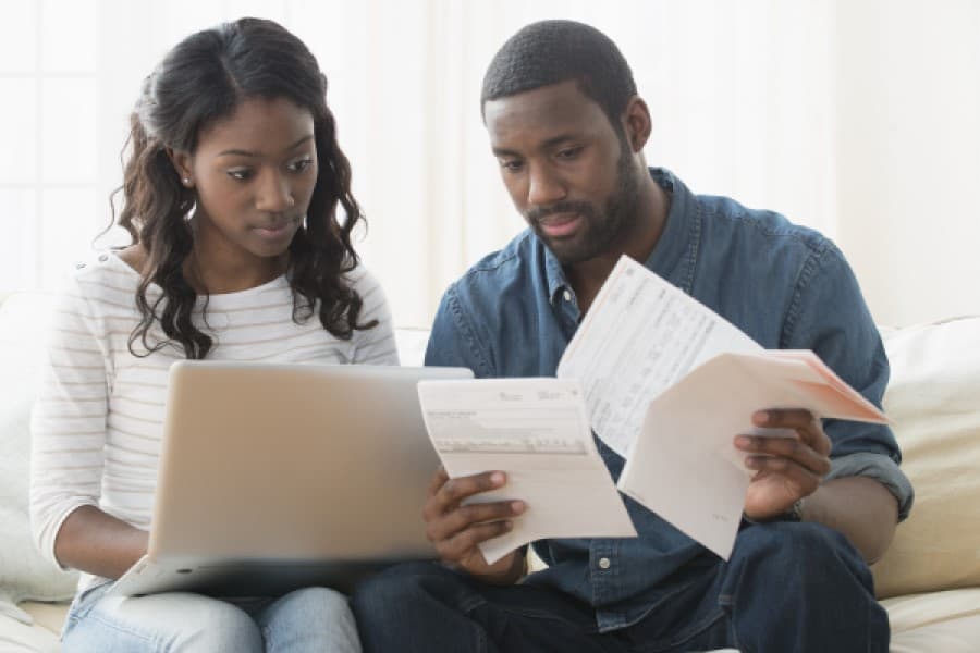 Young couple struggling with financial literacy.