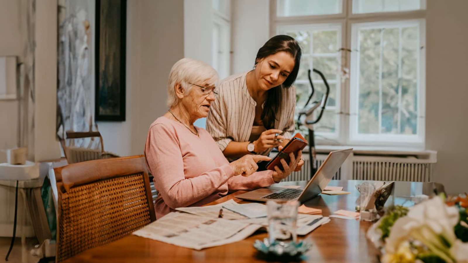 Daughter and mother discussing finances