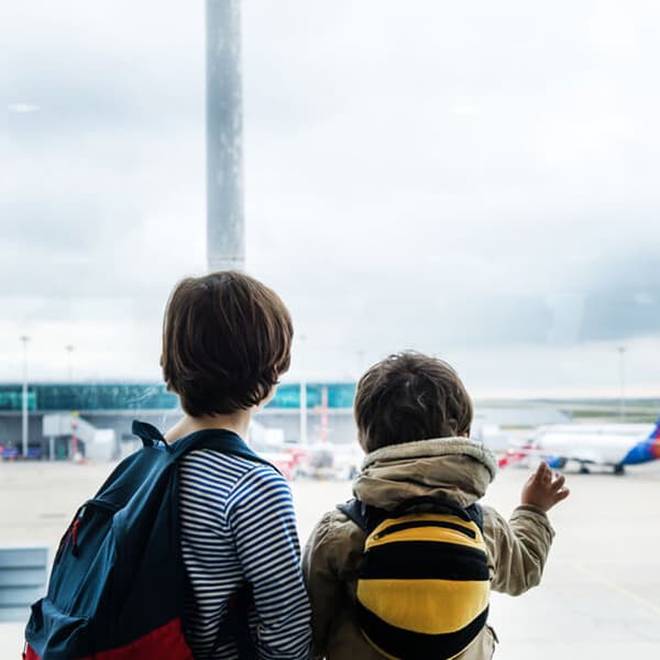 Two kids in an airport.