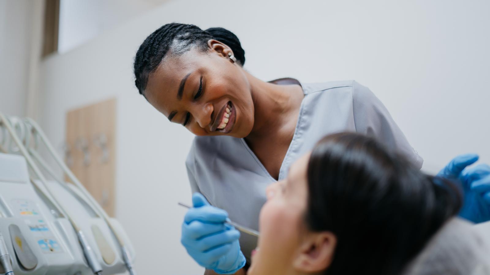 Female dentist checking a patients teeth