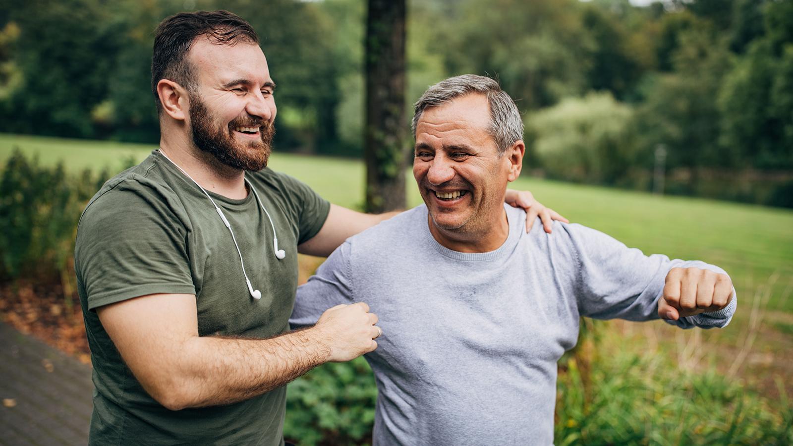 Father and son jogging together. 