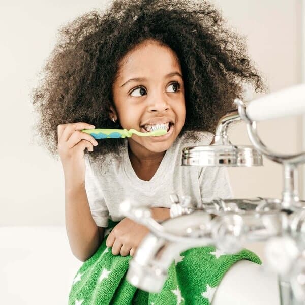 Little girl brushing her teeth.