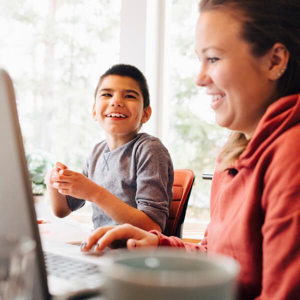 Mom and son with a laptop.