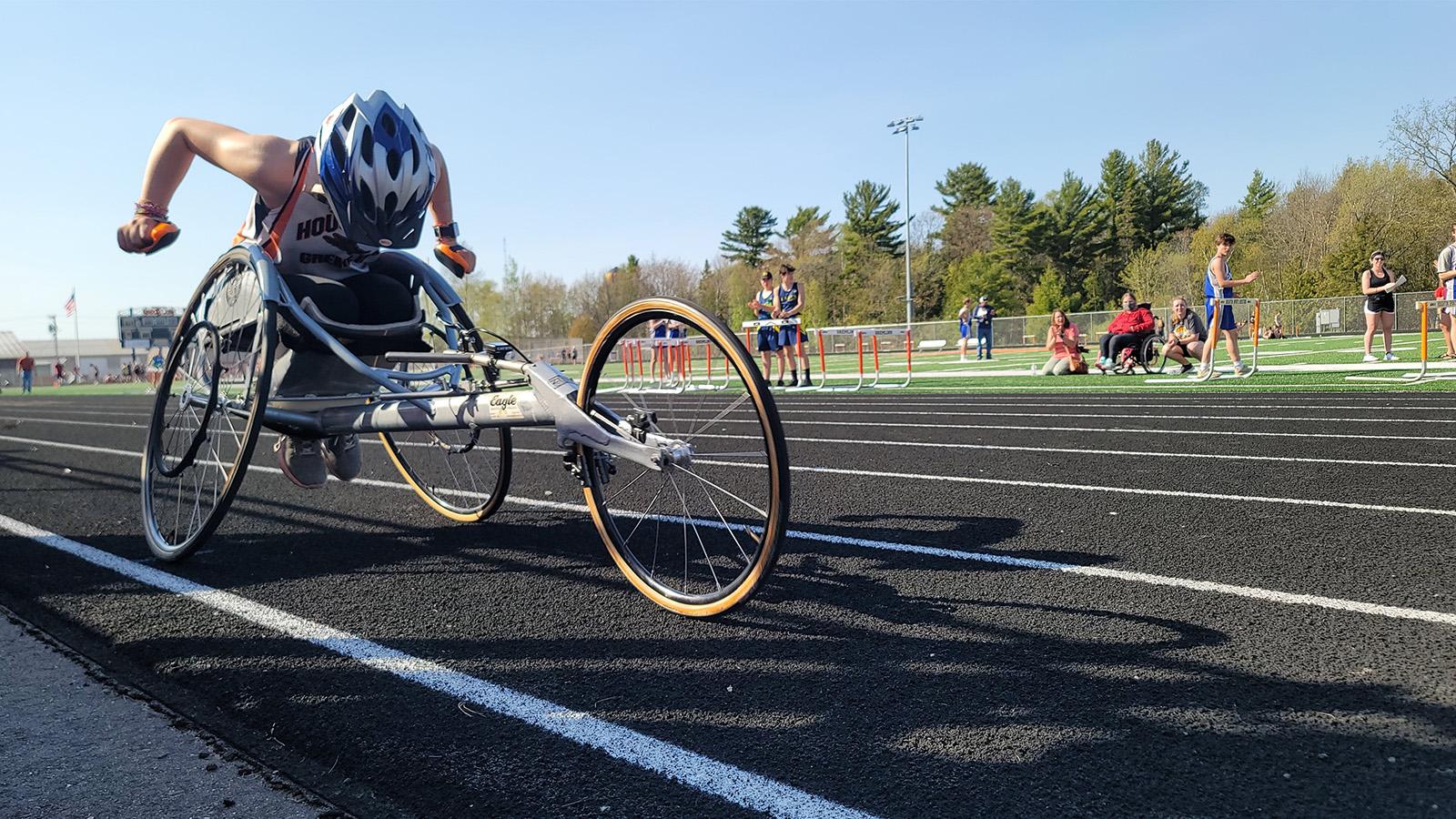 Maria Velat on the track and preparing for a para-cycling event
