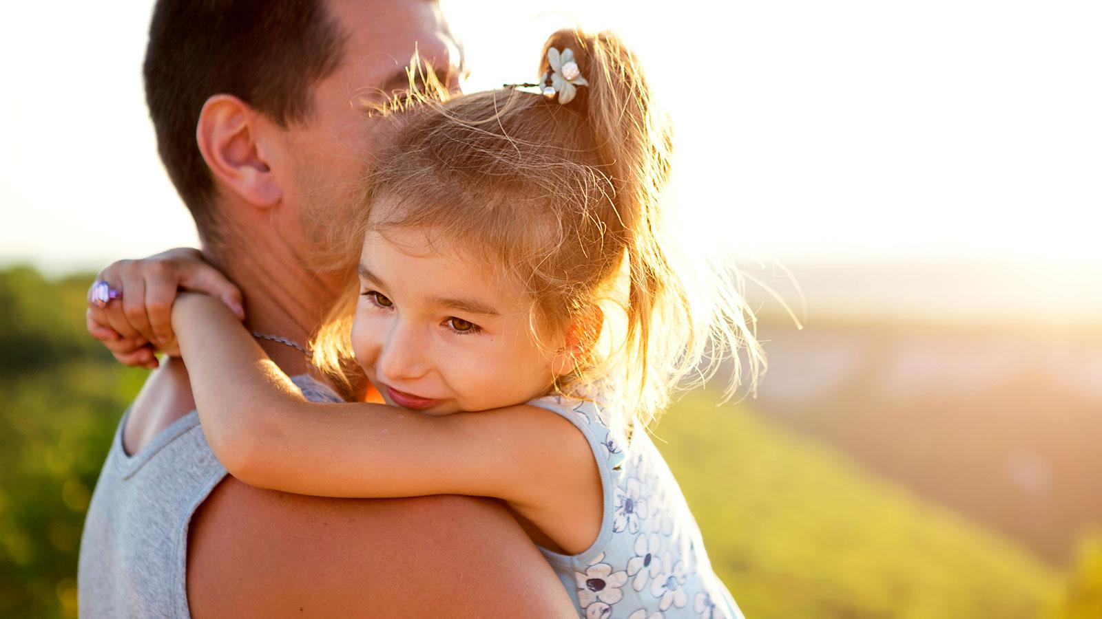 Father-holding-daughter