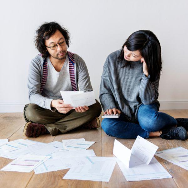 A couple looking at insurance papers.