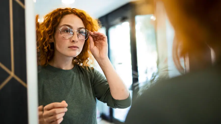 Woman trying on glasses