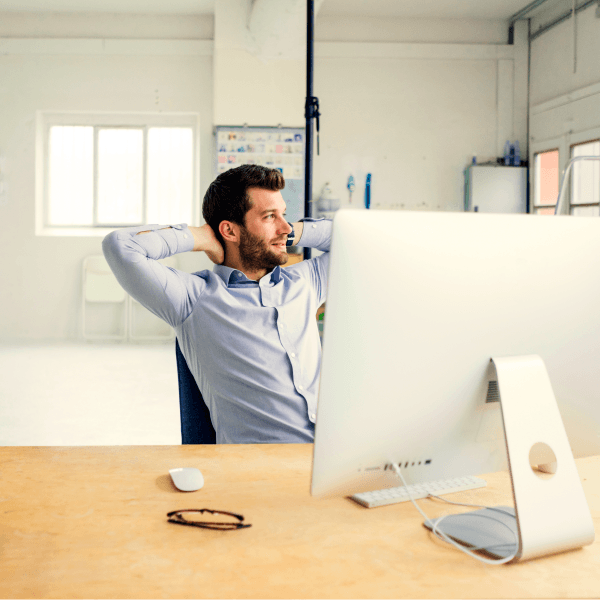 Benefits administrator relaxing after digitizing employee benefits processes.