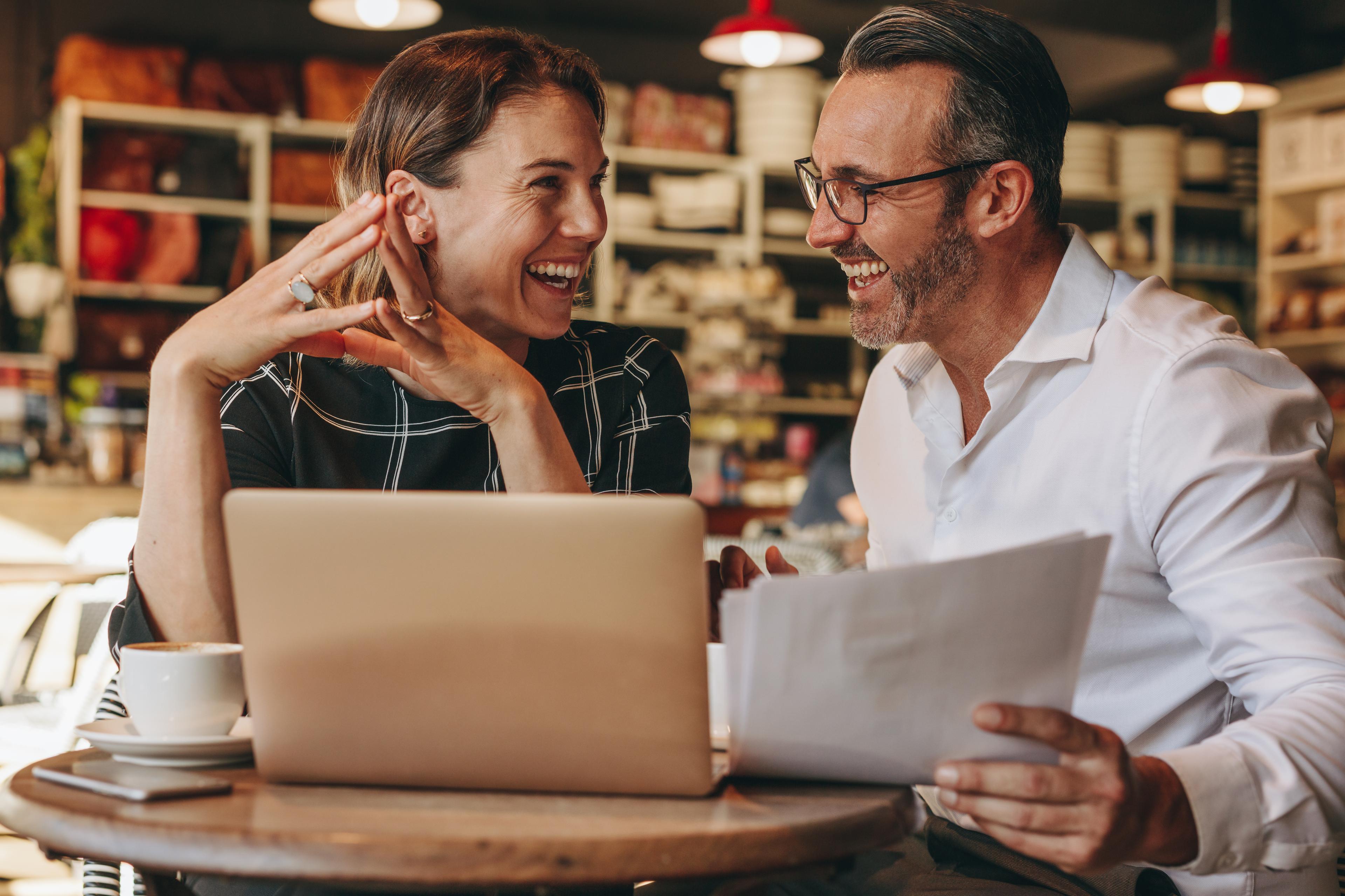 Smiling people working at coffee shop