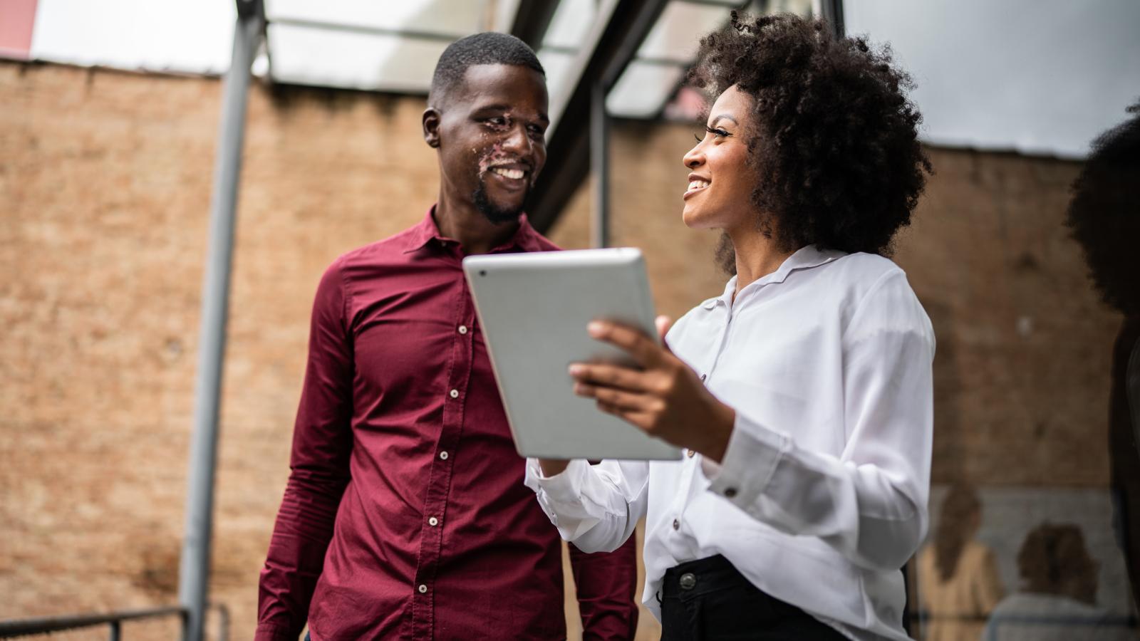 Broker and client happily discussing insurance options