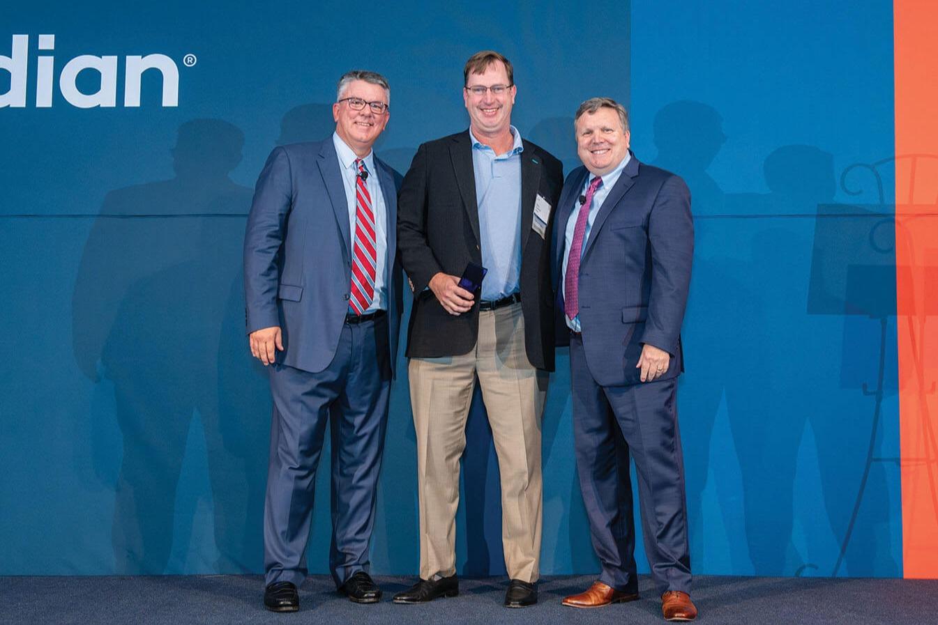 Steven Crawford, joined by Ed Youmell on the left and Larry Hazzard on the right