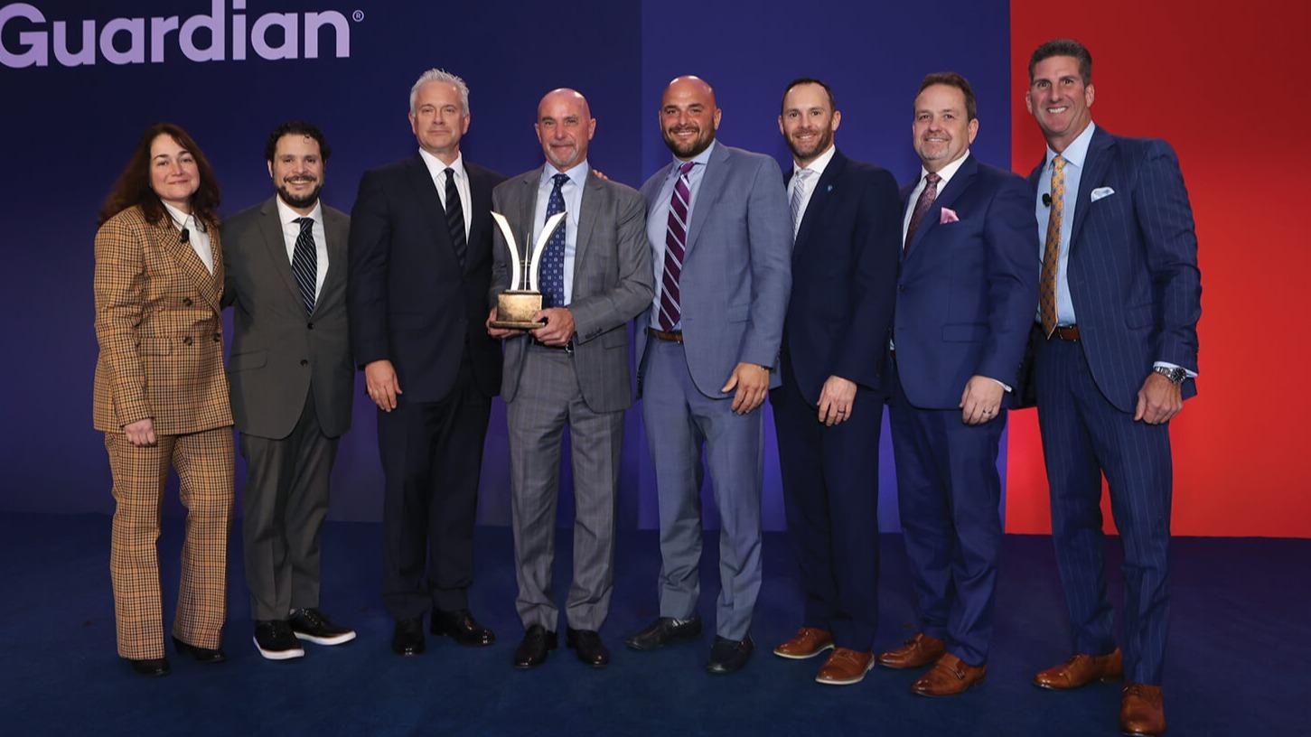 Strategies for Wealth, led by Bobby Angel, Jeff Neeck, Josh Becker, Jerry Tavella, Joe Long, Lyle Domenitz, joined by Leyla Lesina on the left and Kevin DeGray on the right