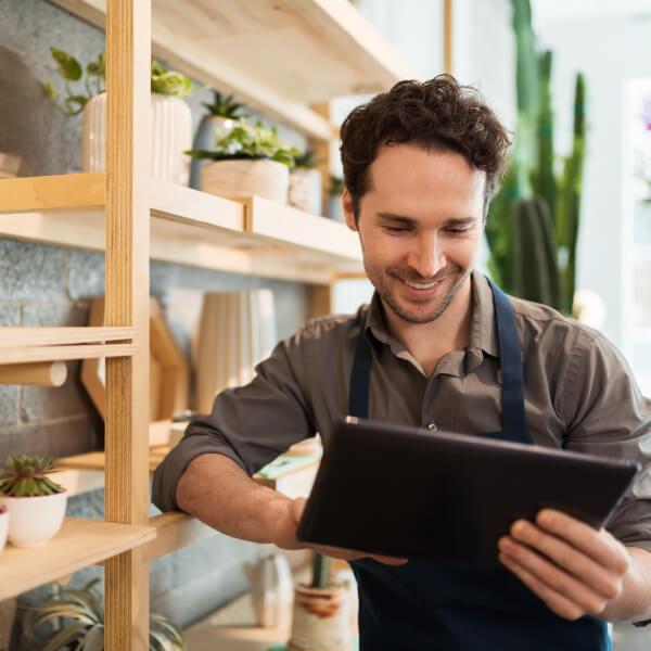 Small business owner learning about digitalizing workplace benefits.