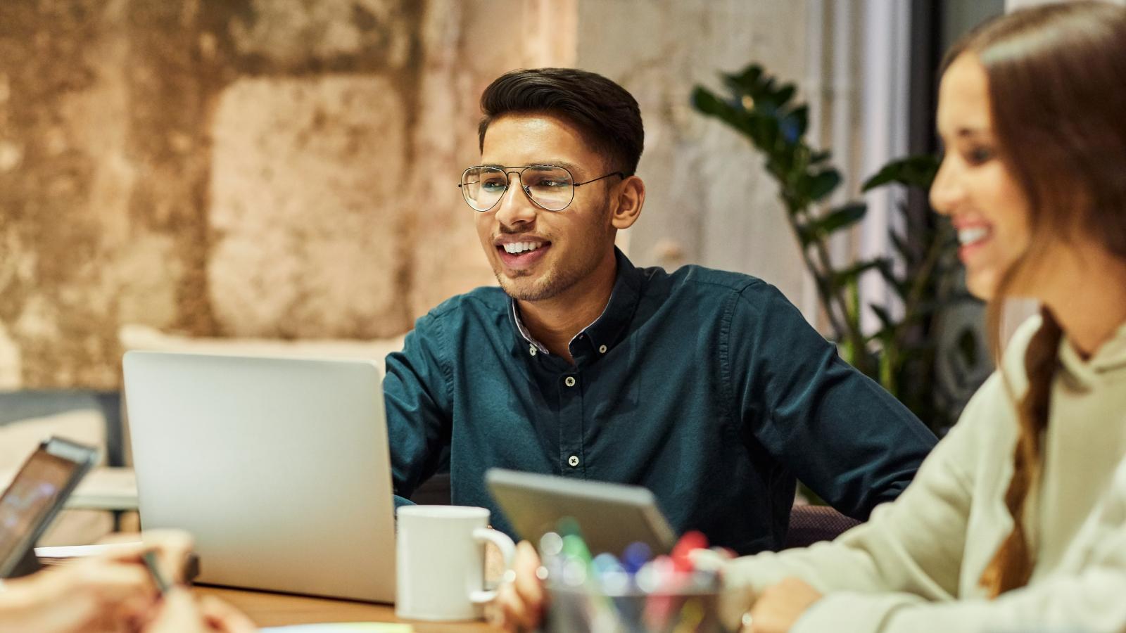 Man collaborating with coworkers in an office