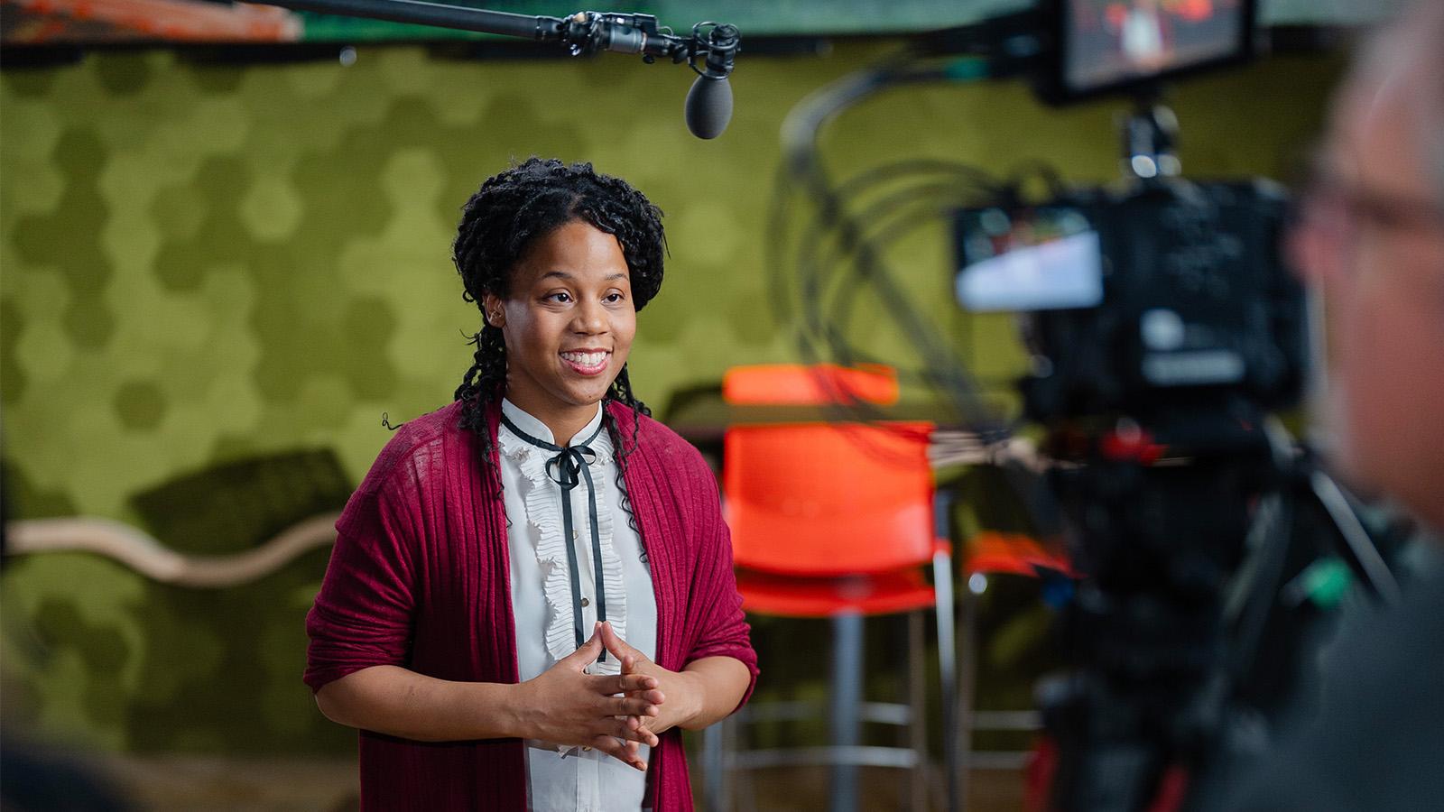 Sandra Battle speaking at the podium