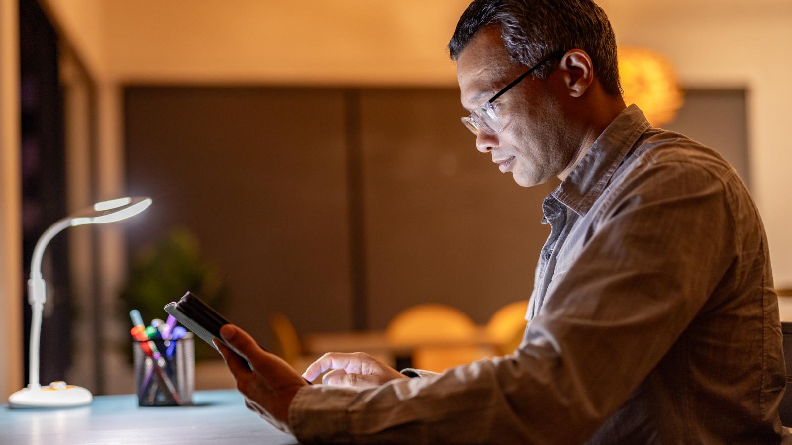 Man using phone at desk