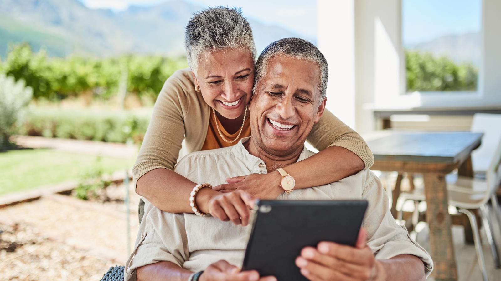 Old couple making video call using tablet