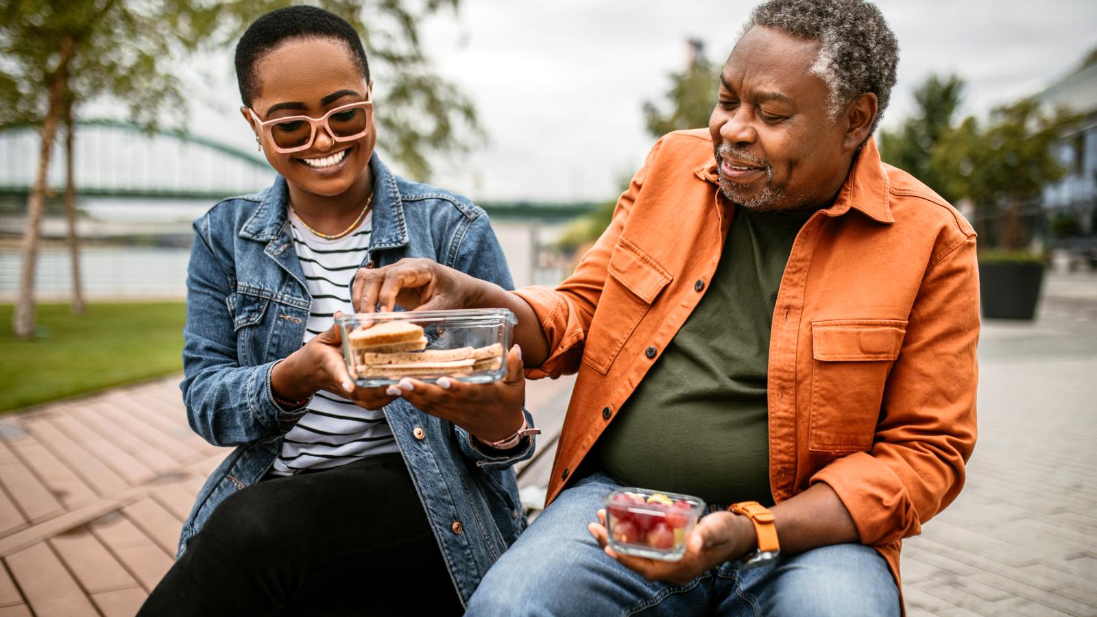 Adult and father eating at the park
